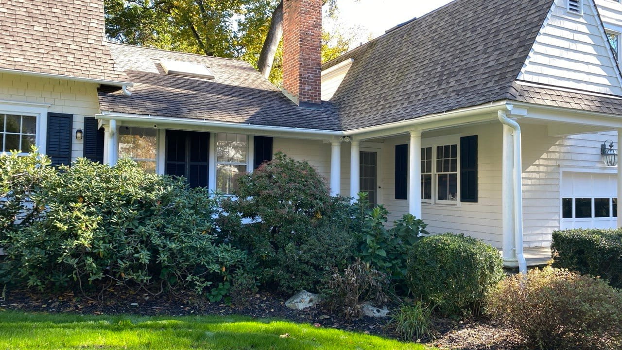 Gutter repair on Cape Cod style home